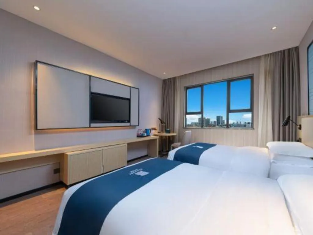 Bed in Echarm Hotel Hefei Binhu Exhibition Center