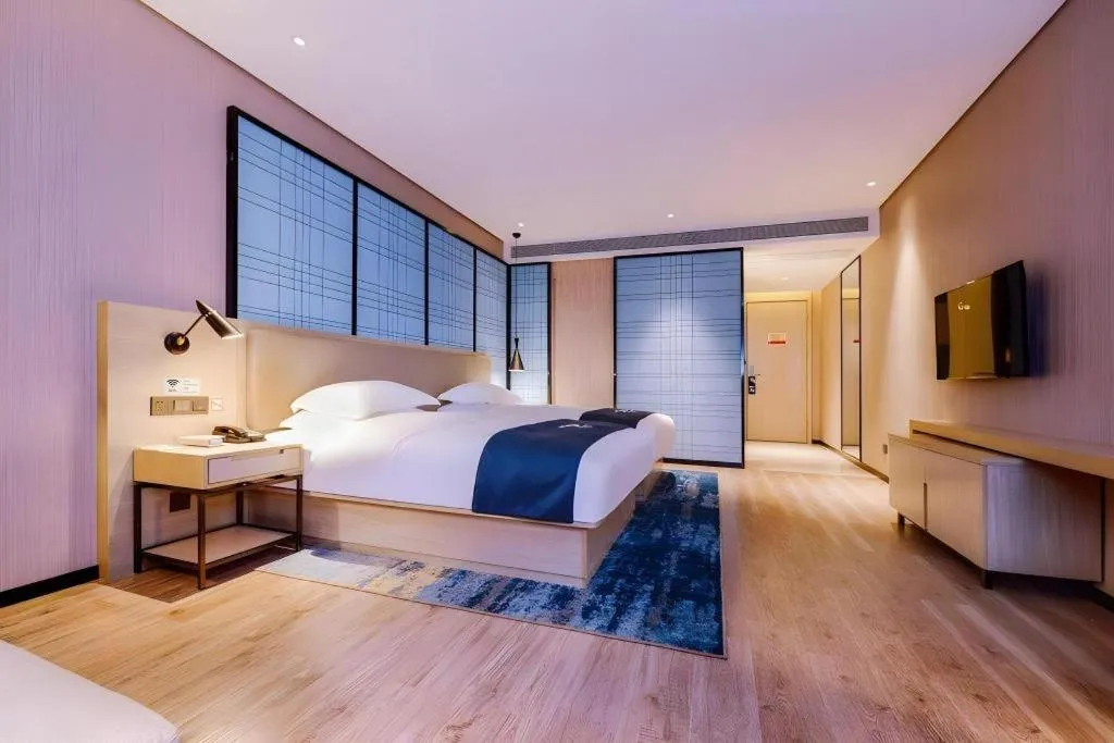 Bed in Echarm Hotel Guizhou Xingyi Jushan Avenue