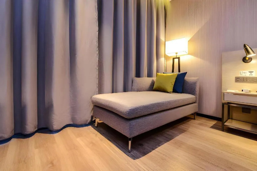 Bed in Echarm Hotel Guizhou Xingyi Jushan Avenue