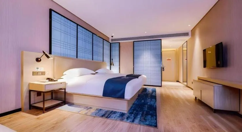 Bed in Echarm Hotel Guizhou Xingyi Jushan Avenue