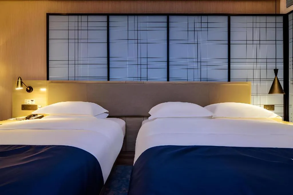 Bed in Echarm Hotel Guizhou Xingyi Jushan Avenue
