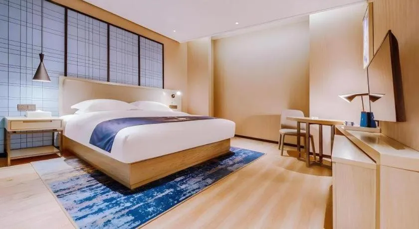 Bed in Echarm Hotel Guizhou Xingyi Jushan Avenue