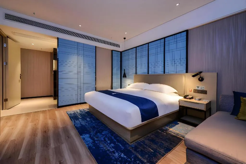 Bed in Echarm Hotel Guizhou Xingyi Jushan Avenue