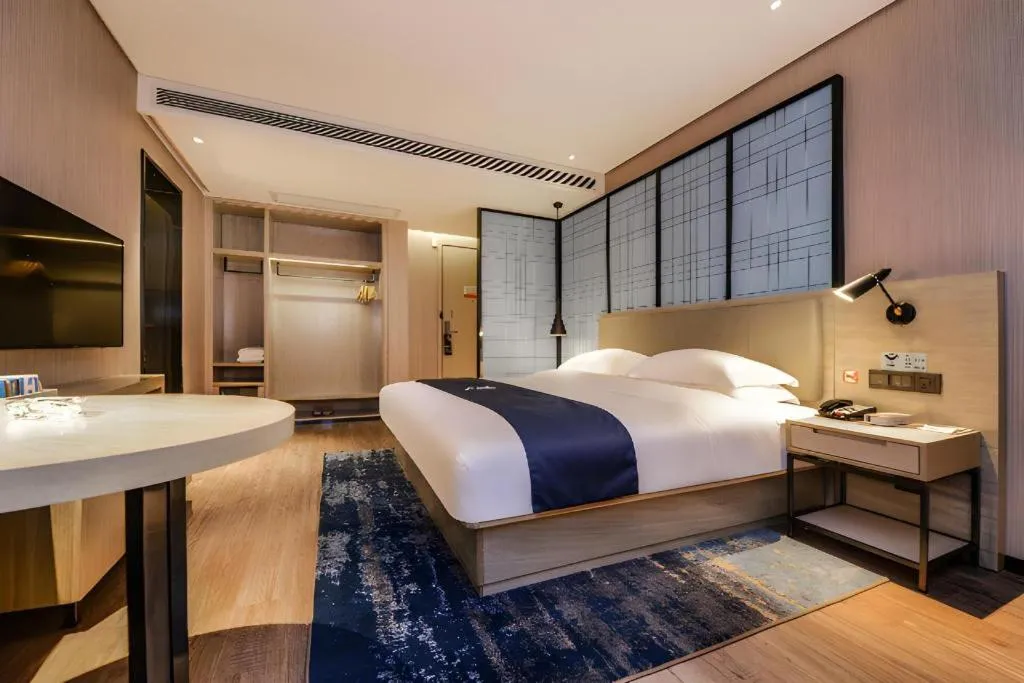 Bed in Echarm Hotel Guizhou Xingyi Jushan Avenue