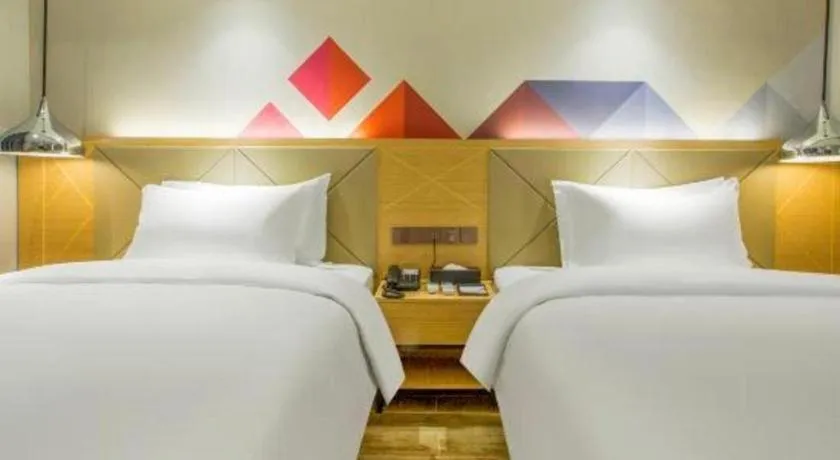 Bed in Borrman Hotel Zhuhai Gongbei Port Fuhuali Light Rail