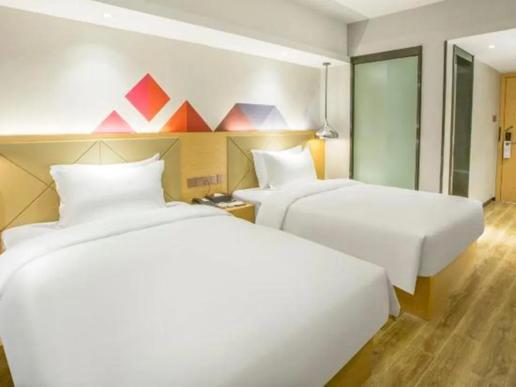 Bed in Borrman Hotel Zhuhai Gongbei Port Fuhuali Light Rail