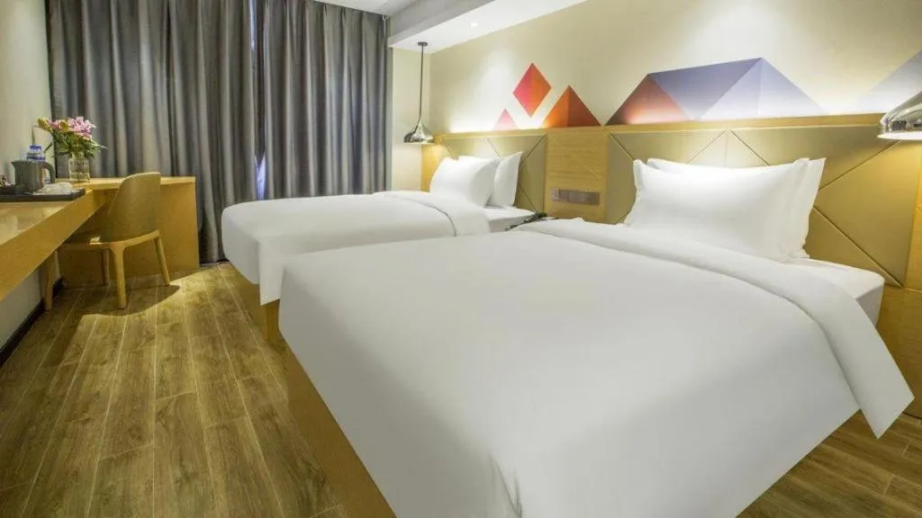 Bed in Borrman Hotel Zhuhai Gongbei Port Fuhuali Light Rail