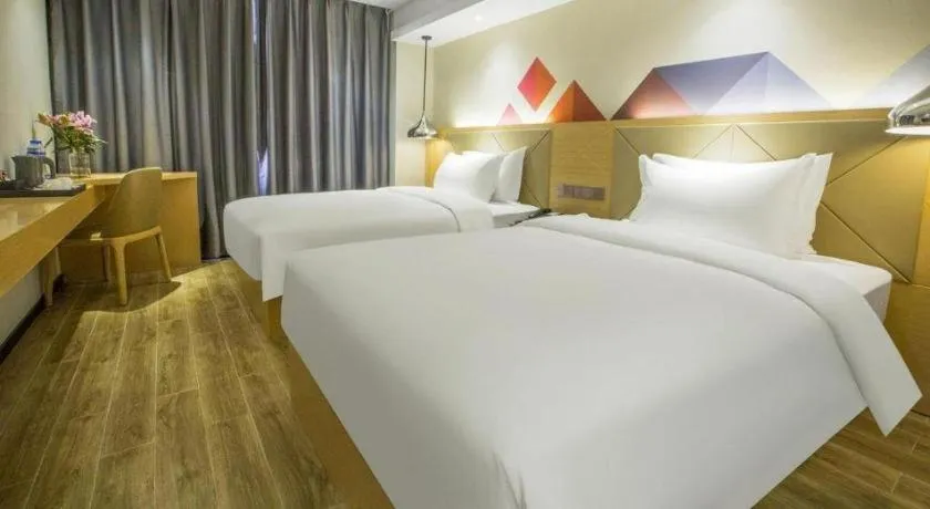Bed in Borrman Hotel Zhuhai Gongbei Port Fuhuali Light Rail