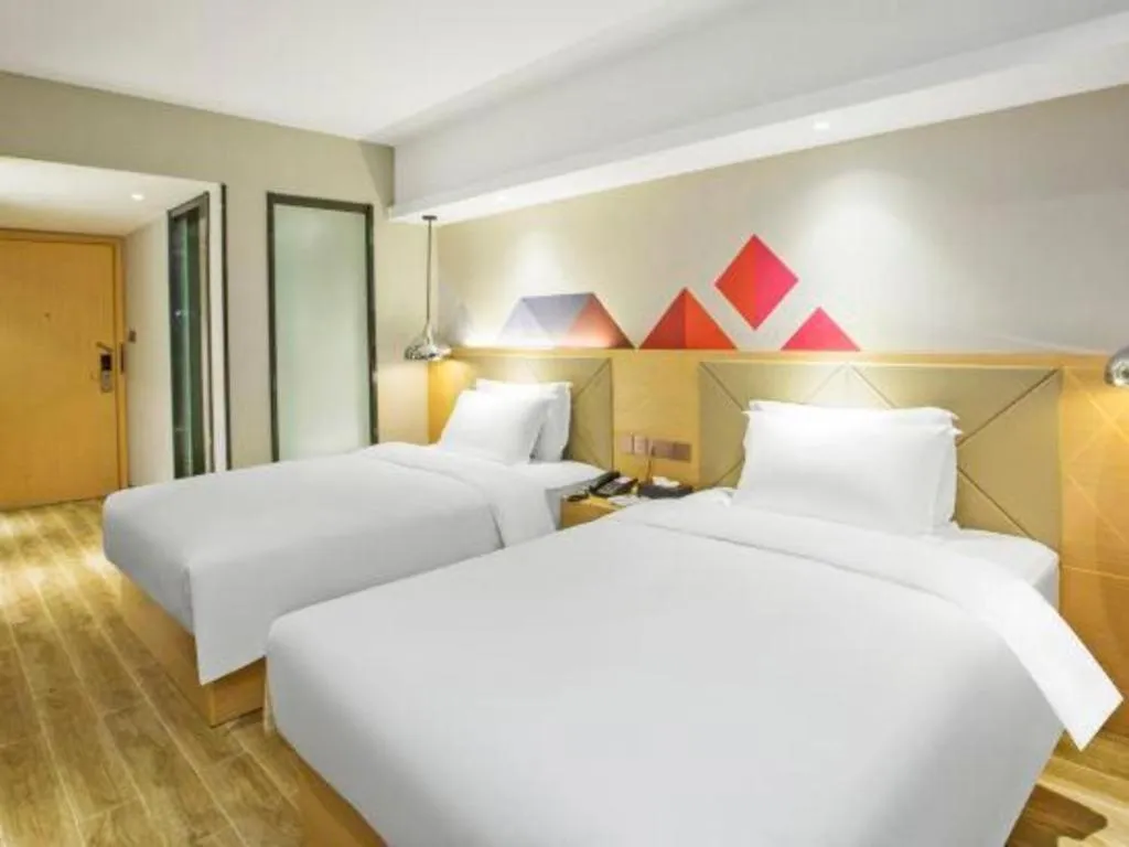Bed in Borrman Hotel Zhuhai Gongbei Port Fuhuali Light Rail