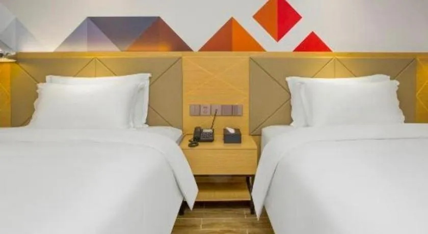 Bed in Borrman Hotel Zhuhai Gongbei Port Fuhuali Light Rail