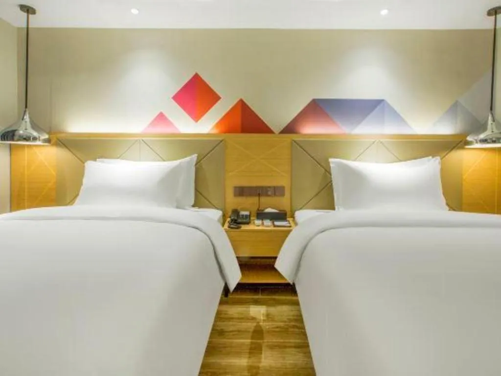 Bed in Borrman Hotel Zhuhai Gongbei Port Fuhuali Light Rail