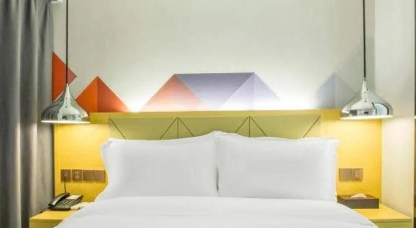 Bed in Borrman Hotel Zhuhai Gongbei Port Fuhuali Light Rail