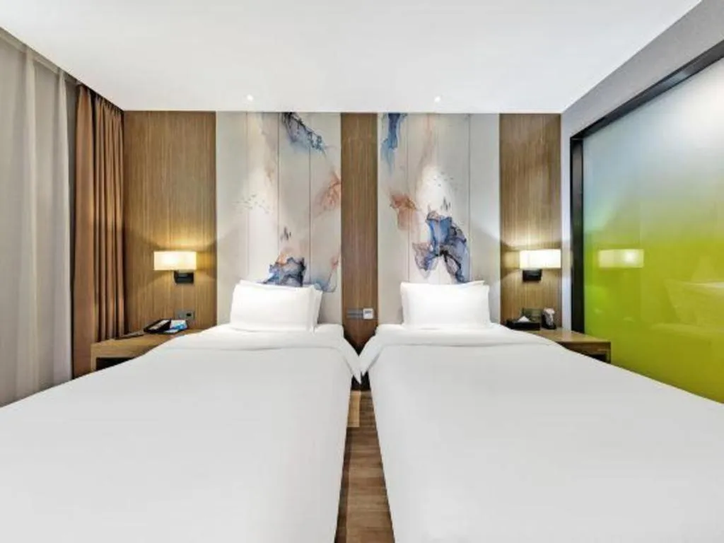 Bed in ZMAX Hotel Beijing Tongzhou Universal Tourist Resort Linheli Metro Station