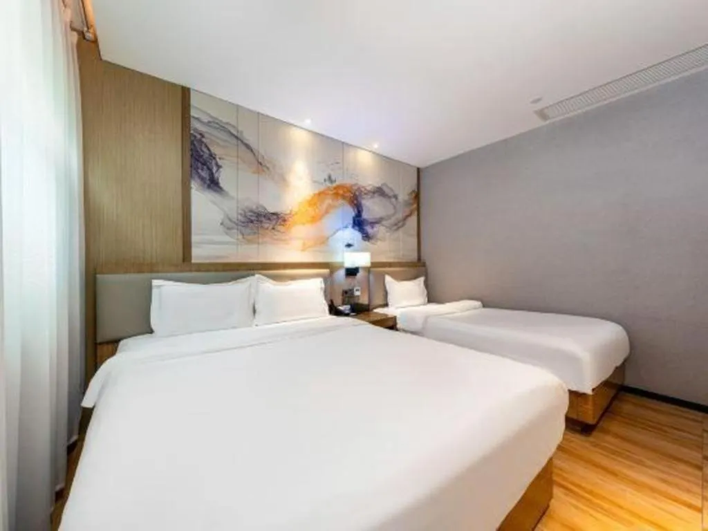 Bed in ZMAX Hotel Beijing Tongzhou Universal Tourist Resort Linheli Metro Station
