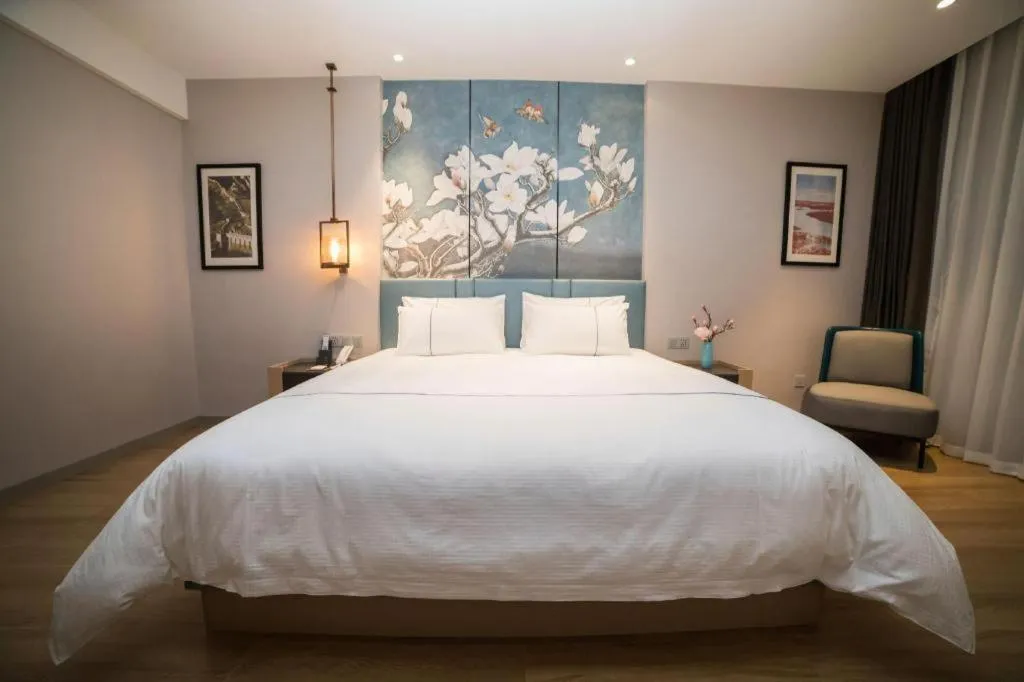 Bed in Magnotel Huludao Xingcheng Central Square Wenquan Street