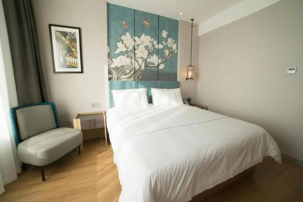 Bed in Magnotel Huludao Xingcheng Central Square Wenquan Street
