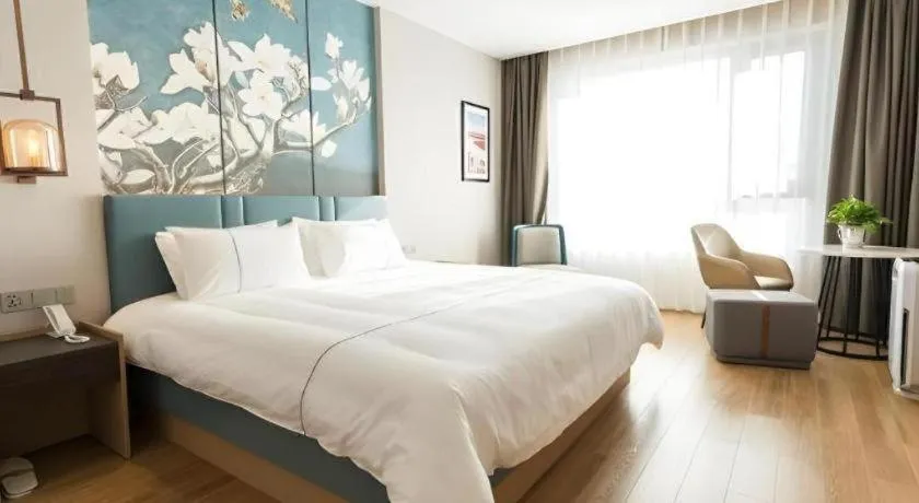 Bed in Magnotel Huludao Xingcheng Central Square Wenquan Street