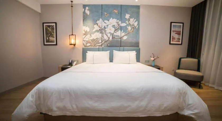 Bed in Magnotel Huludao Xingcheng Central Square Wenquan Street