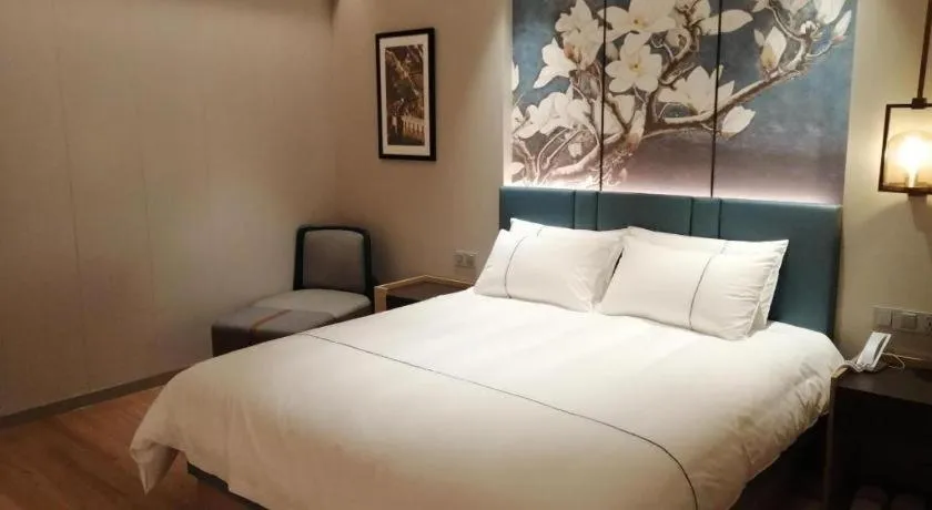 Bed in Magnotel Huludao Xingcheng Central Square Wenquan Street