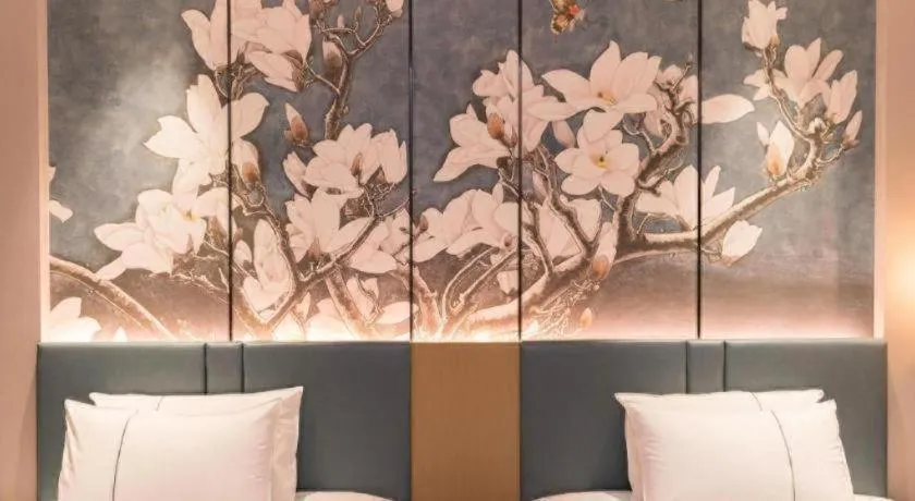 Bed in Magnotel Huludao Xingcheng Central Square Wenquan Street