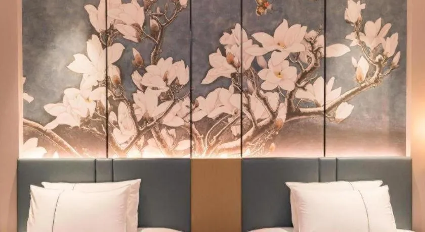 Bed in Magnotel Huludao Xingcheng Central Square Wenquan Street