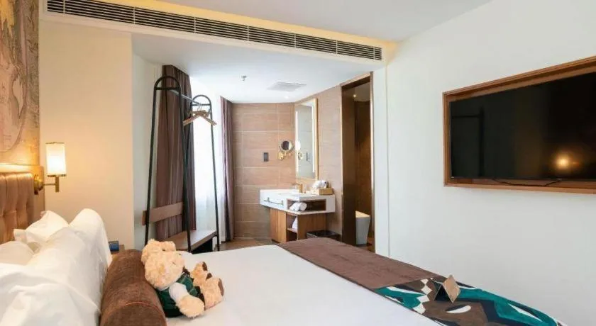 Bed in James Joyce Coffetel Shenyang North Railway Station Qishan Road Metro Station