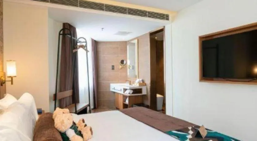 Bed in James Joyce Coffetel Shenyang North Railway Station Qishan Road Metro Station