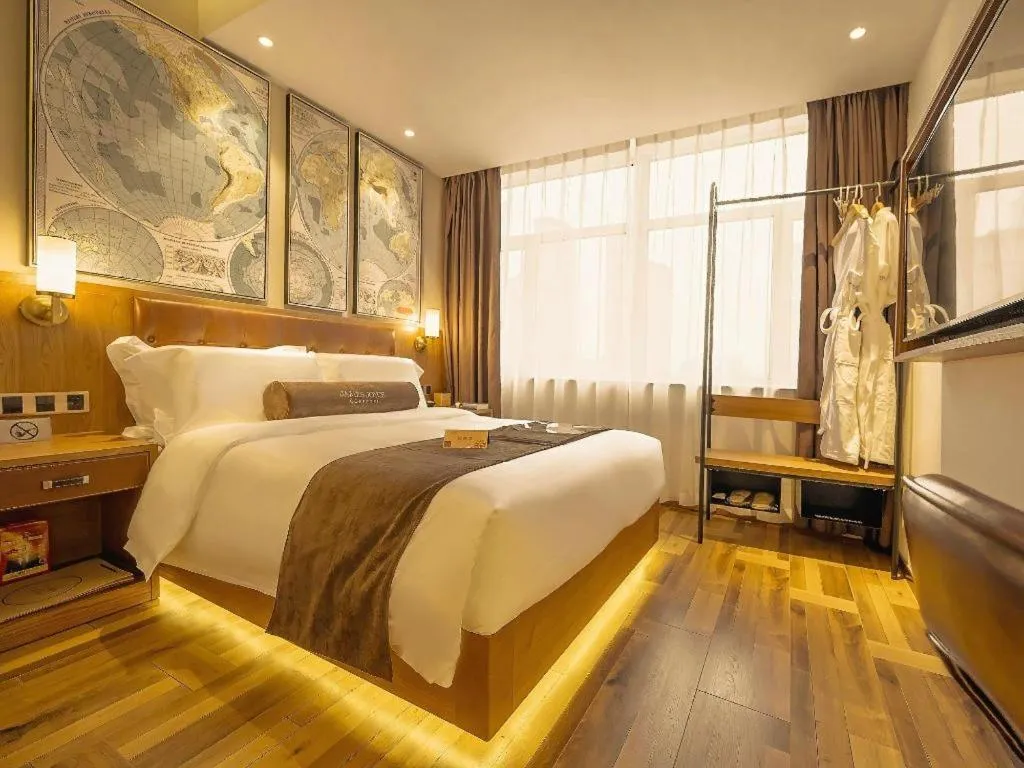 Bed in James Joyce Coffetel Shenyang North Railway Station Qishan Road Metro Station