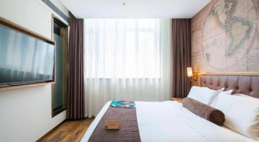 Bed in James Joyce Coffetel Shenyang North Railway Station Qishan Road Metro Station