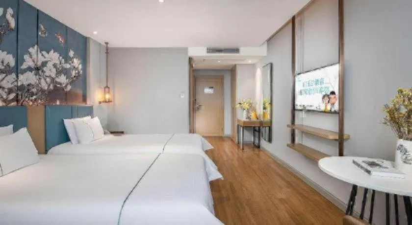 Bed in Magnotel Hotel Dongxing Guomen Port