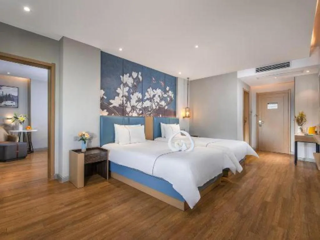 Bed in Magnotel Hotel Dongxing Guomen Port