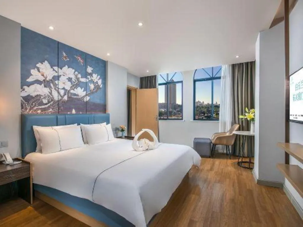 Bed in Magnotel Hotel Dongxing Guomen Port