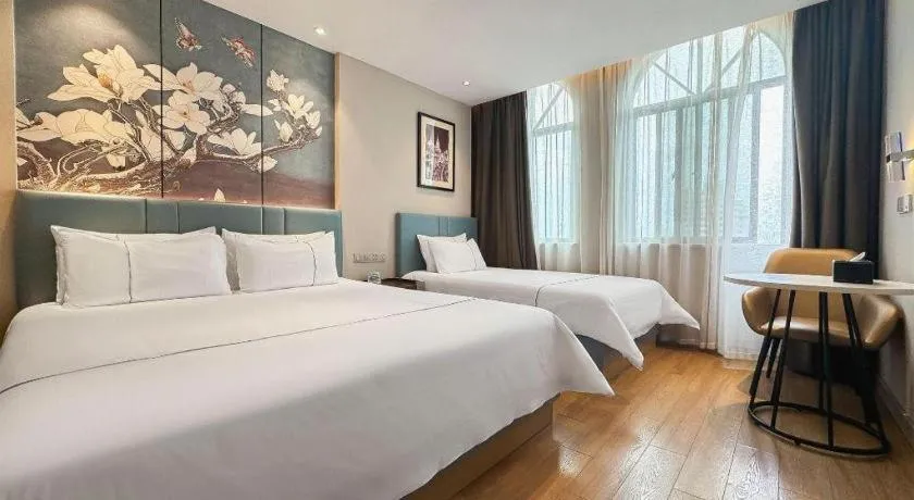 Bed in Magnotel Hotel Dongxing Guomen Port