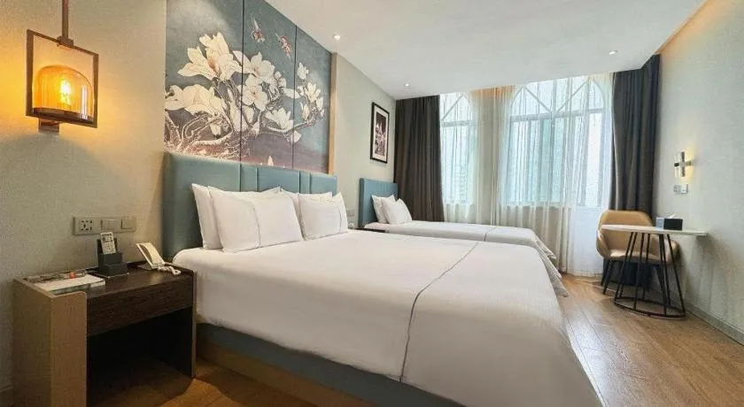 Bed in Magnotel Hotel Dongxing Guomen Port