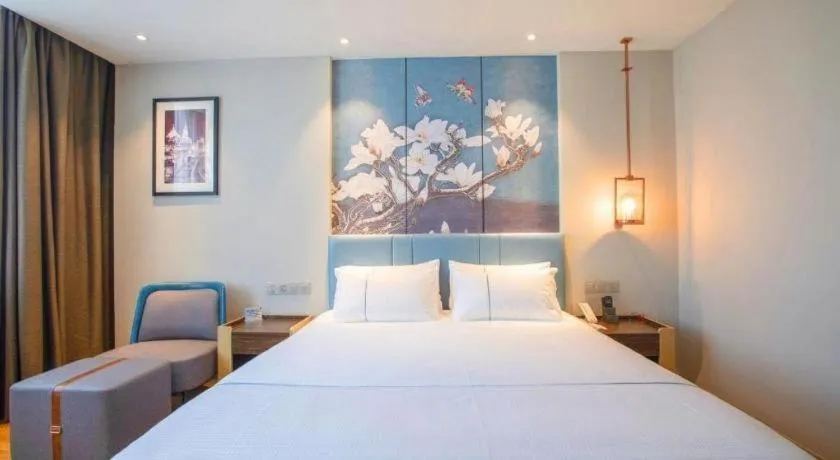 Bed in Magnotel Hotel Dongxing Guomen Port