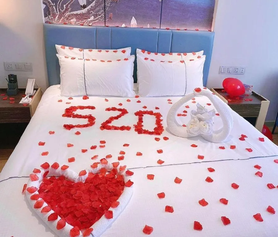 Bed in Magnotel Hotel Dongxing Guomen Port