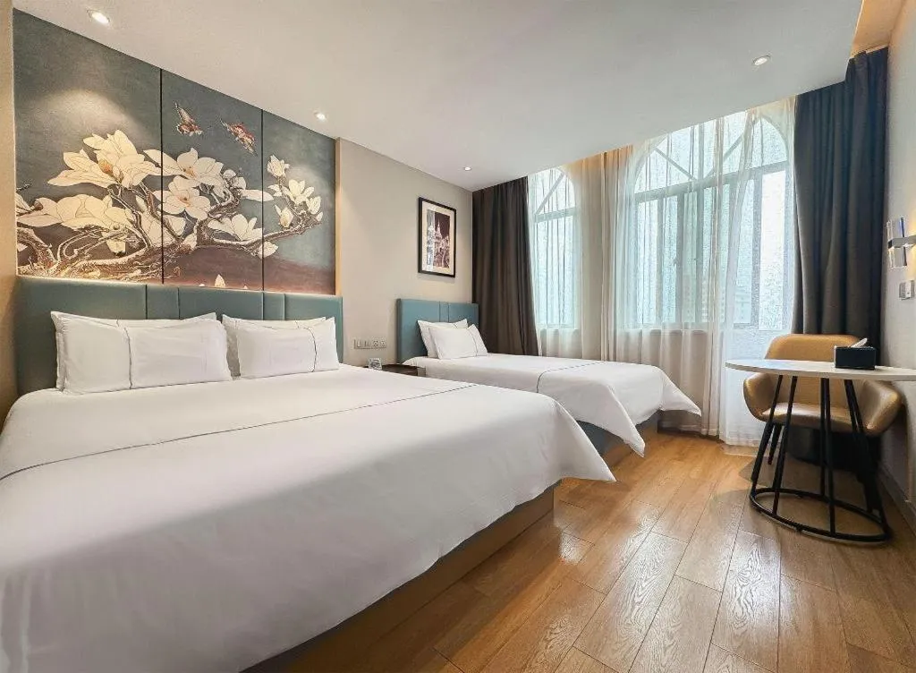 Bed in Magnotel Hotel Dongxing Guomen Port