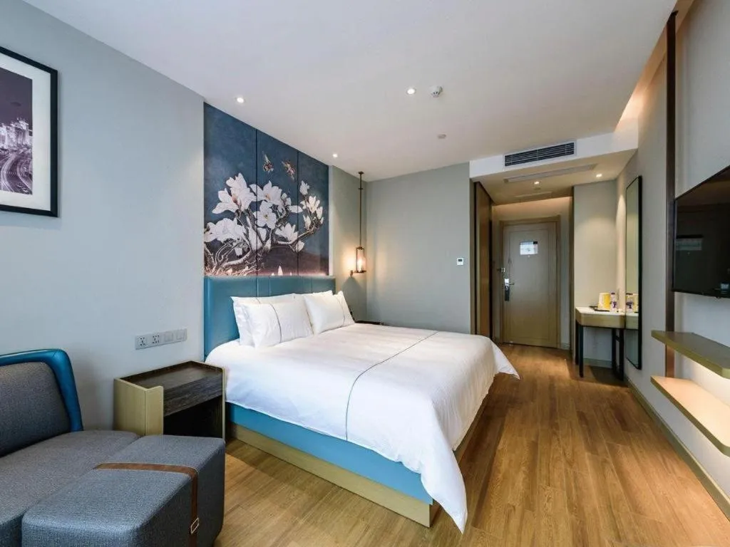 Bed in Magnotel Hotel Dongxing Guomen Port