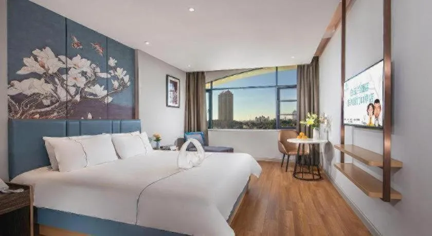 Bed in Magnotel Hotel Dongxing Guomen Port