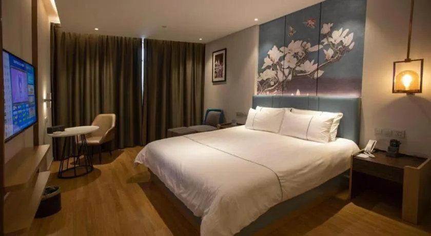 Bed in Magnotel Hotel Dongxing Guomen Port