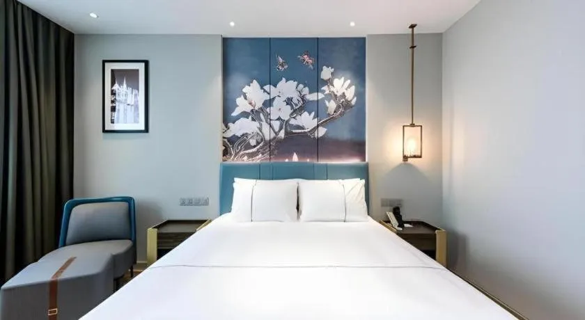 Bed in Magnotel Hotel Dongxing Guomen Port