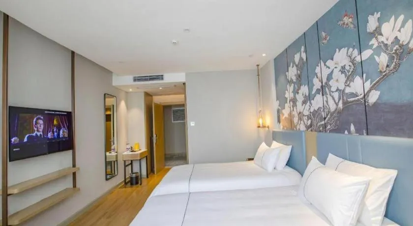 Bed in Magnotel Hotel Dongxing Guomen Port