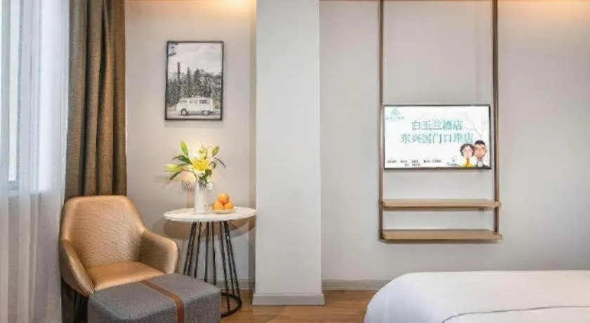 Bed in Magnotel Hotel Dongxing Guomen Port