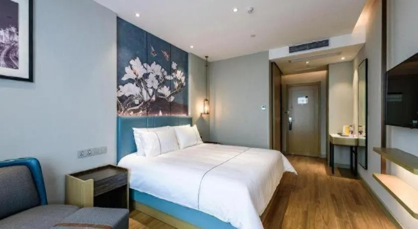 Bed in Magnotel Hotel Dongxing Guomen Port