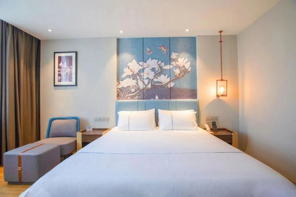 Bed in Magnotel Hotel Dongxing Guomen Port