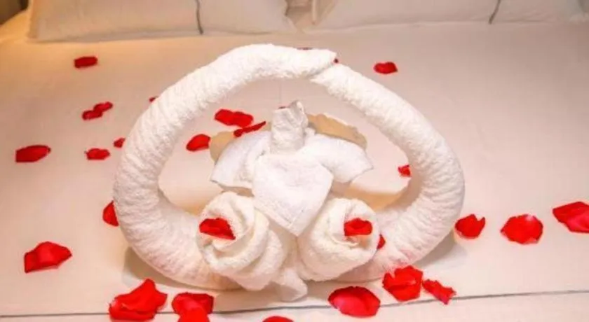 Bed in Magnotel Hotel Dongxing Guomen Port