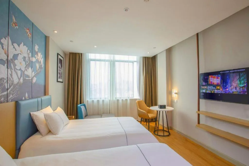 Bed in Magnotel Hotel Dongxing Guomen Port