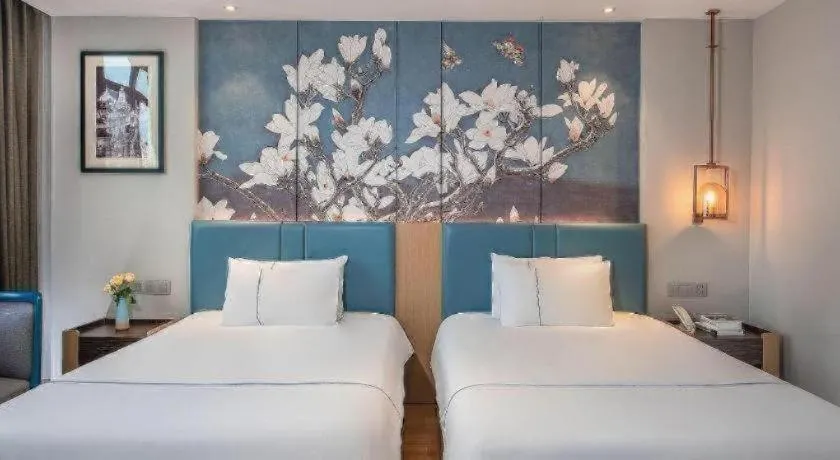 Bed in Magnotel Hotel Dongxing Guomen Port