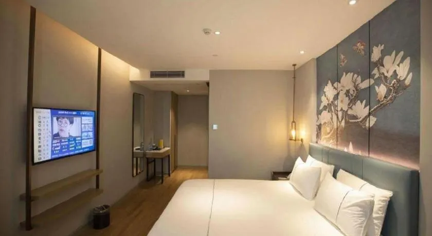 Bed in Magnotel Hotel Dongxing Guomen Port