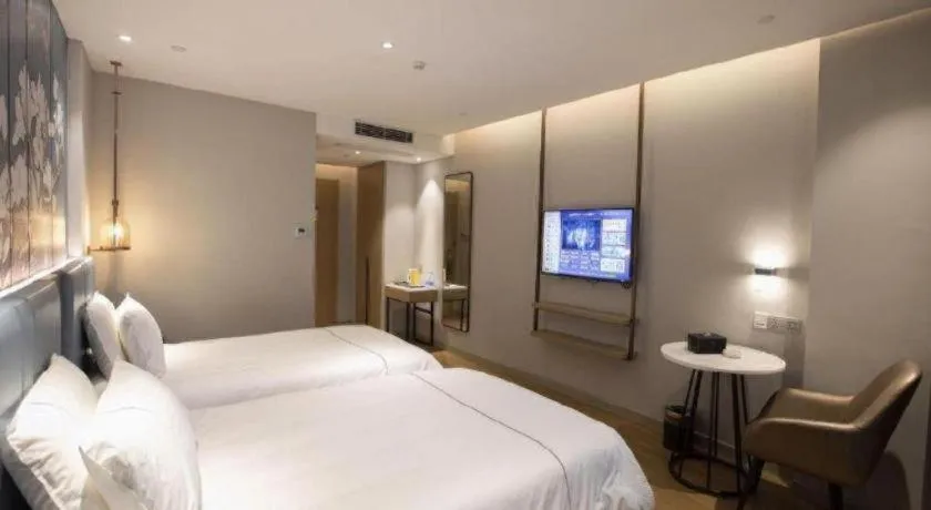 Bed in Magnotel Hotel Dongxing Guomen Port